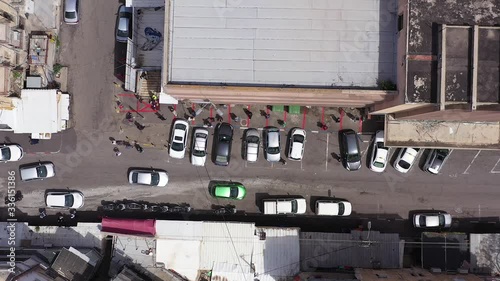 Corona Virus days, People waiting in line at safe distance for Fever checking at Talpiot food market two days before Passover Seder, due to Government guidelines. photo