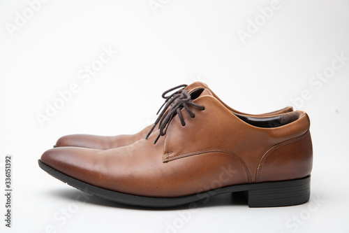 Brown leather shoes isolated on white background.