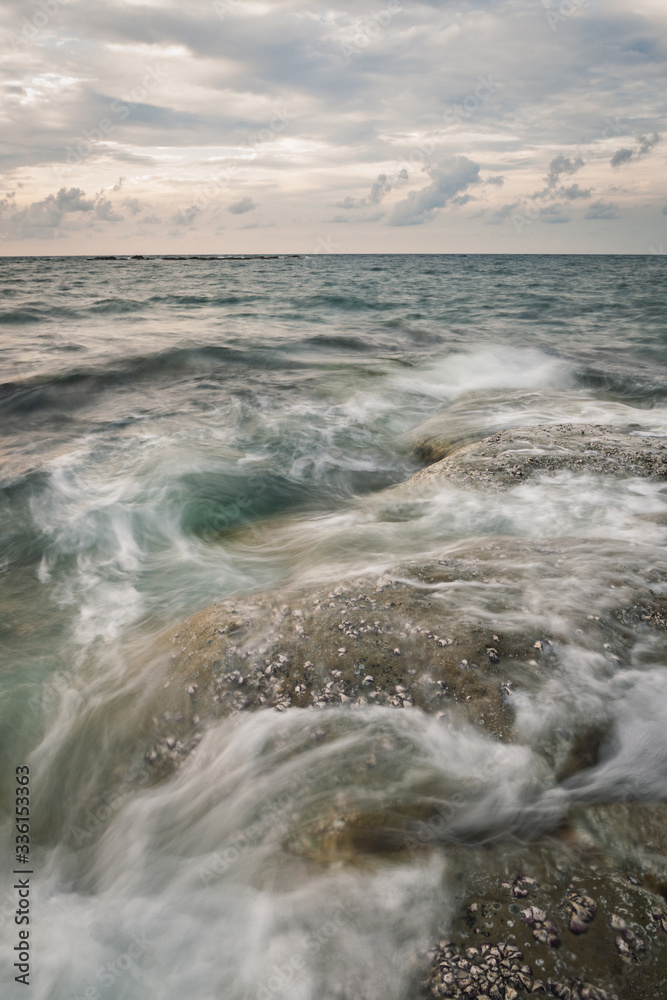 Fototapeta premium Long exposure sea and rocks at twilight