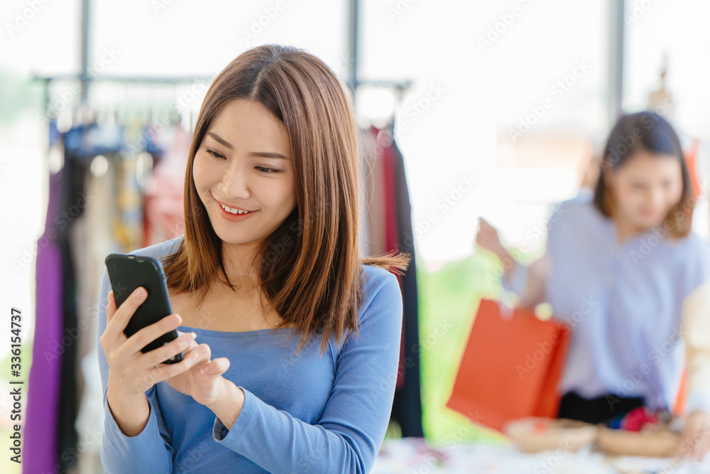 Smart customer using mobile phone to finding promotion search sale item and payment in shopping store Smart customer using mobile phone to finding promotion search sale item and payment in shopping store