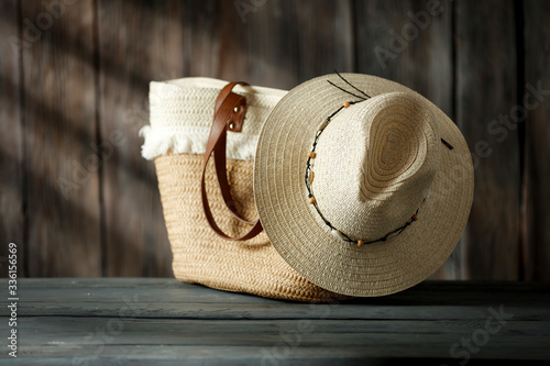 Summer background of free space for your decoration and bag with hat on board. 