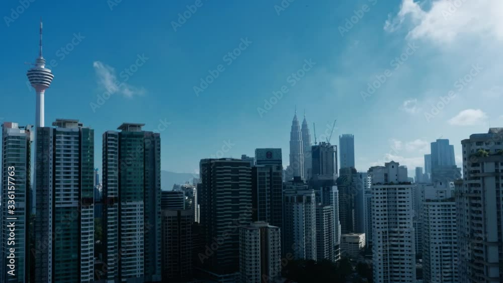 Timelapse cityscape. Kuala Lumpur city center. View of the twin towers of Petronas and KL Menara. From dawn to dusk. Part 1 of 4 Timelapse cityscape. Kuala Lumpur city center. View of the twin towers of Petronas and KL Menara. From dawn to dusk. Part 1 of 4