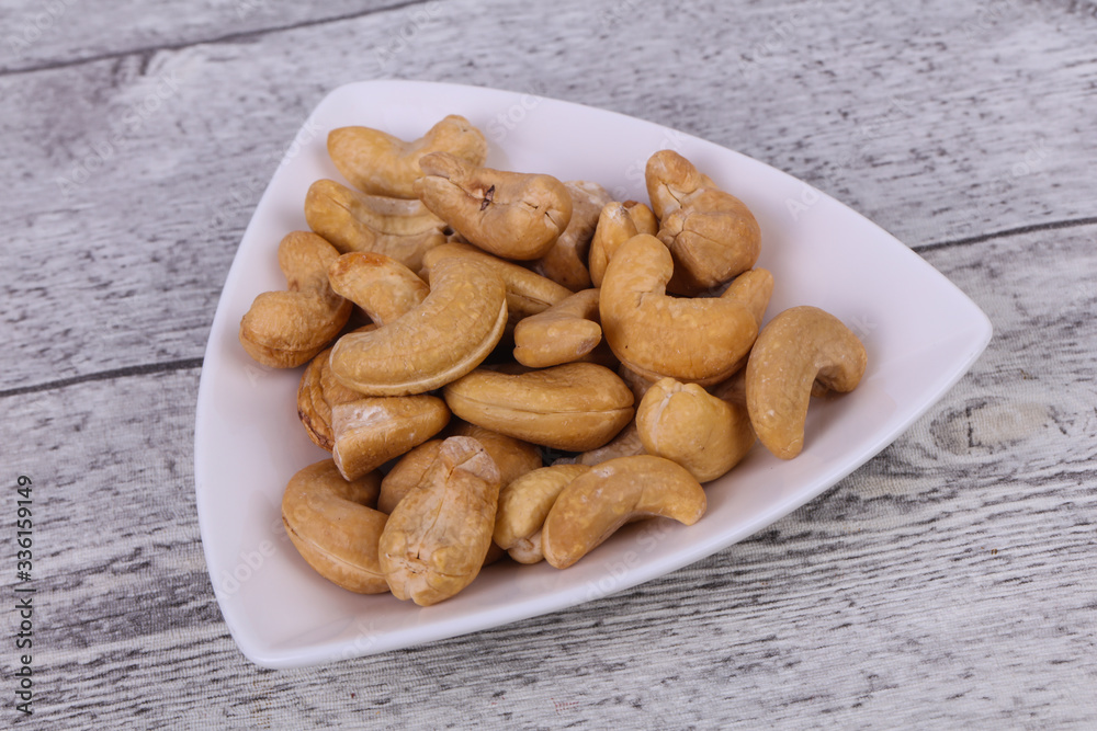 Cashew nuts heap in the bowl Cashew nuts heap in the bowl