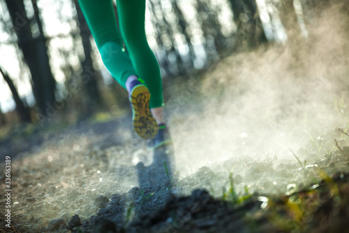 young active womans runner legs jogging running  in the forestgrass sport training healthy life style concept photo