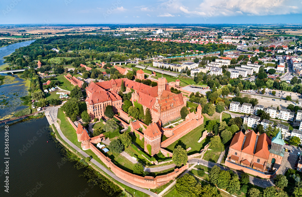 The Castle of the Teutonic Order in Malbork on the bank of the Nogat River. UNESCO world heritage in Poland