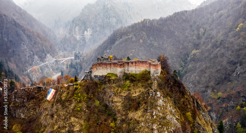 Ruined Poenari Castle in romania mountains photo