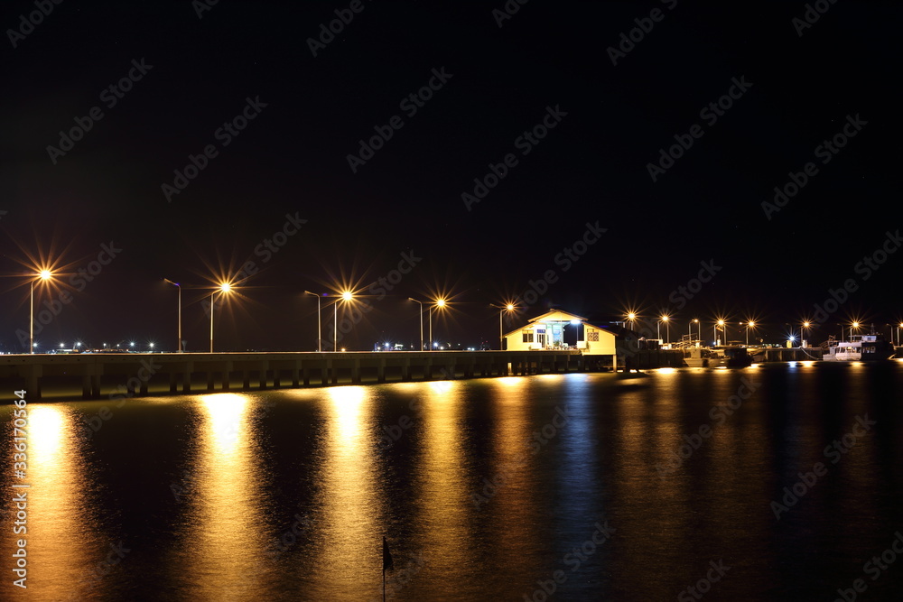The lights of the harbor water reflection at Sattahip, Chon Buri, Thailand