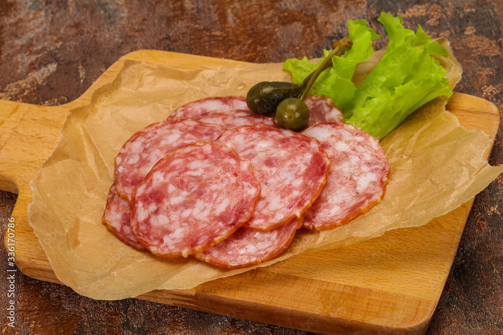 Fototapeta premium Spanish Salchichon sausage with salad