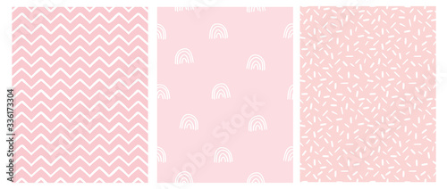 Abstract Hand Drawn Childish Style Seamless Vector Patterns. White Rainbows, Chevron and Spots on a Pink Background. Simple Irregular Childlike Geometric Vector Prints. Pastel Color Design.
