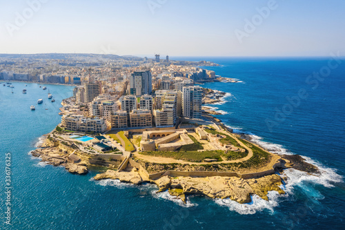 Aerial top view of Tigne Point apartment in Sliema city. Malta island. Sunny day, blue clear sky, Mediterranean sea