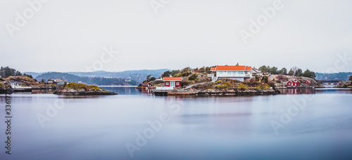 Panorama - The beautiful small islands  around   Kjønnøya  archipelago   at calm foggy day. Hafsund, South Norway photo