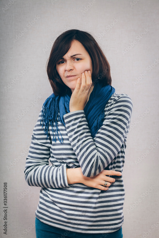 Closeup portrait young woman with sensitive tooth ache Closeup portrait young woman with sensitive tooth ache