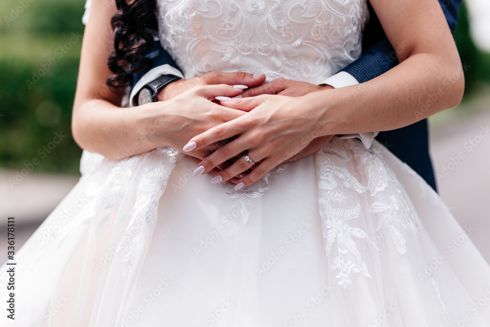 Holding hand groom and bride embracing Holding hand groom and bride embracing