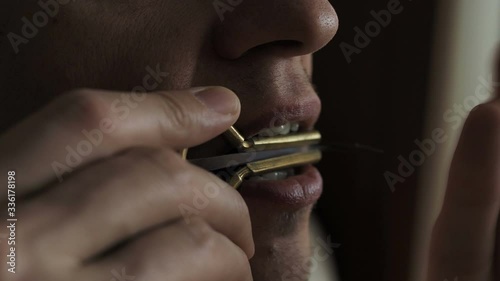  man plays music on a vargan close up