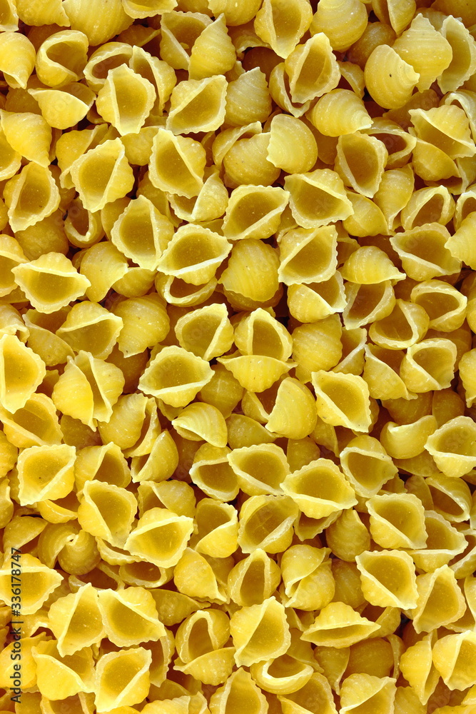 A close up color image of uncooked margheritine soup pasta.