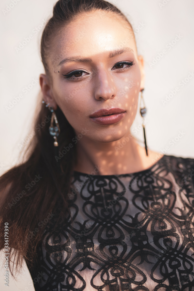 face of beautiful sophisticated girl with shadow play on the face. girl with beautiful lips