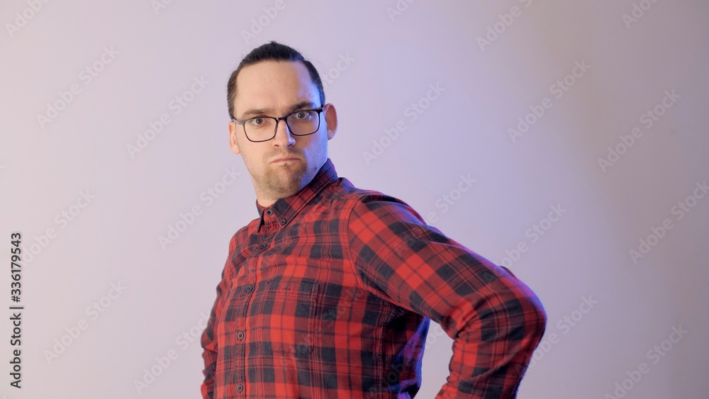 Obraz premium Attractive man feignedly indignant. Portrait of an emotional indignant man. Powerful emotions.