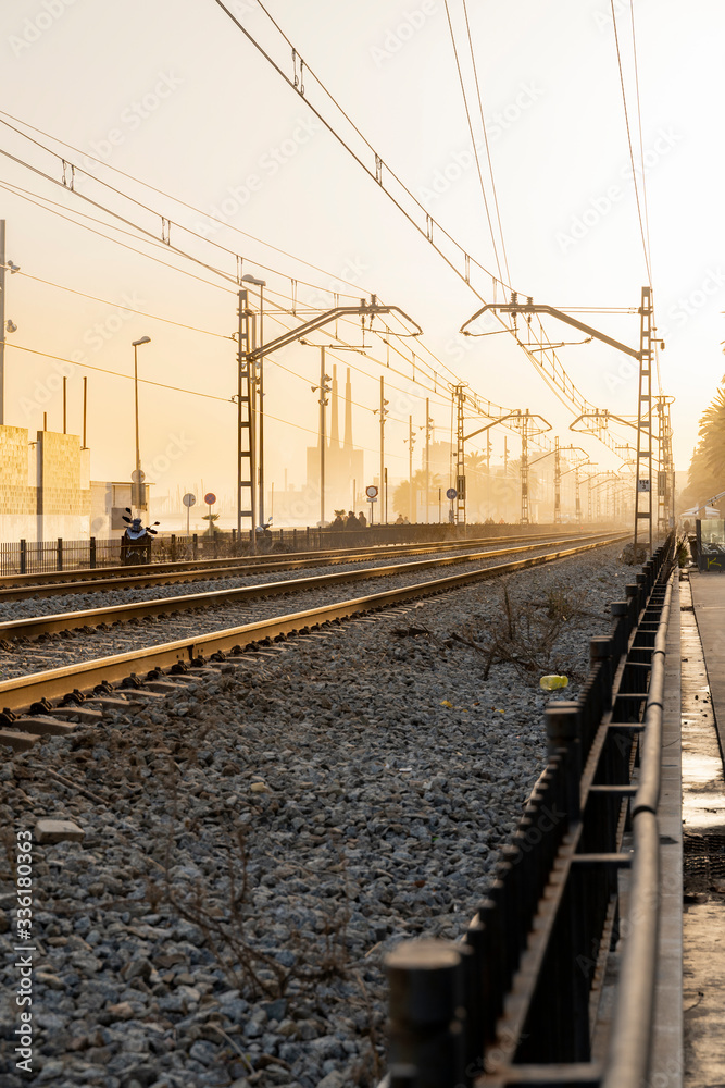 Spain, Barcelona, Badalona, Empty railroad tracks at sunset Spain, Barcelona, Badalona, Empty railroad tracks at sunset