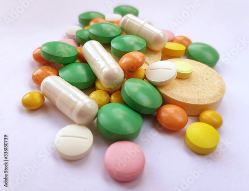 Stack of colourful pills, medicine background