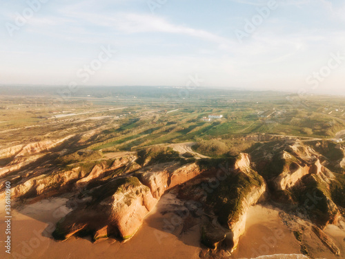 Portugal, Peniche, Aerial view of rugged ocean coastline photo