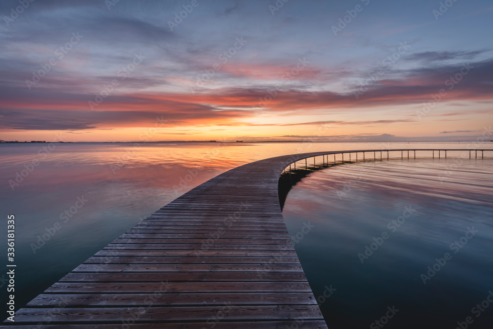 Denmark, Aarhus, Long exposure of Infinite Bridge and Aarhus Bay at sunrise