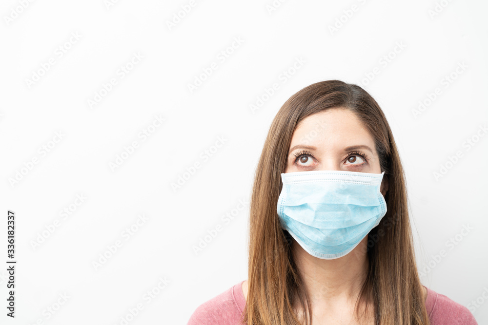 Brunette with mask looking at copy space Brunette with mask looking at copy space