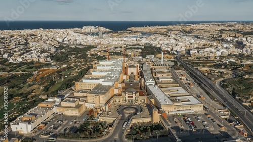 Aerial shot of Mater Dei Hospital in Malta surrounded by other buildings