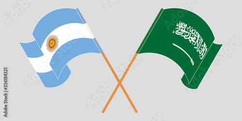 Crossed and waving flags of Argentina and the Kingdom of Saudi Arabia