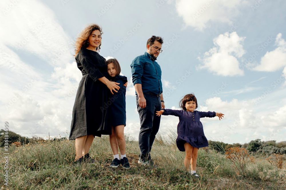 Family with two children spending time together in nature, The Hague, Netherlands Family with two children spending time together in nature, The Hague, Netherlands