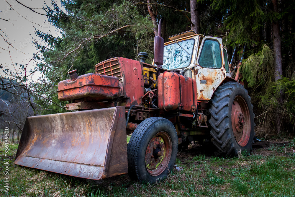 An old abandoned tractor in a former military area