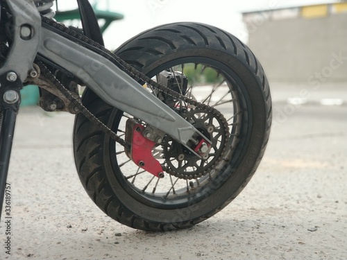 Fototapeta Naklejka Na Ścianę i Meble -  Motorcycle rear wheel on road tires