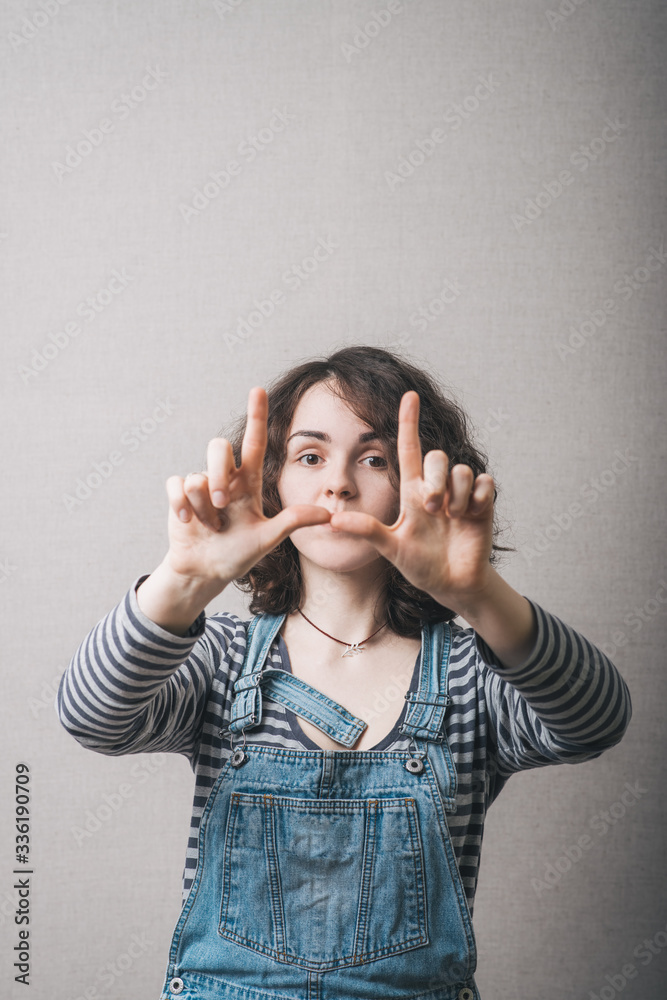 girl doing hand frame girl doing hand frame