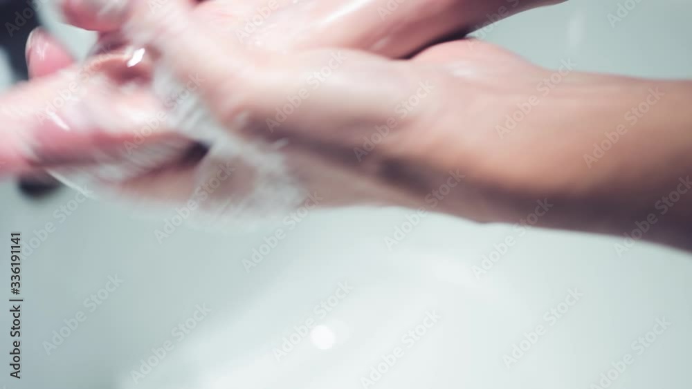 Woman thoroughly washing her hands with water and soap. Coronavirus prevention measures Woman thoroughly washing her hands with water and soap. Coronavirus prevention measures