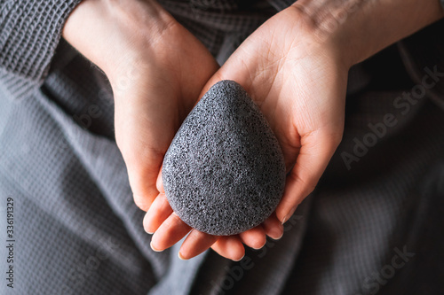 Natural konjac sponge in a female hands, healthy lifestyle.