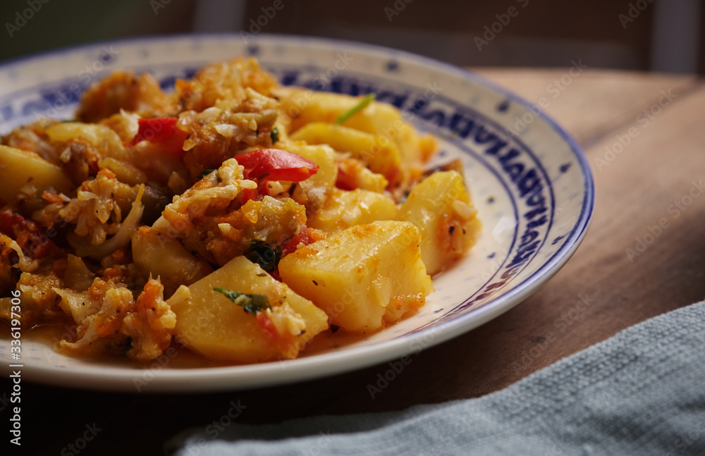 Delicious stew of potatoes, peppers, cauliflower, carrots, onions and green parsley. Delicious stew of potatoes, peppers, cauliflower, carrots, onions and green parsley.