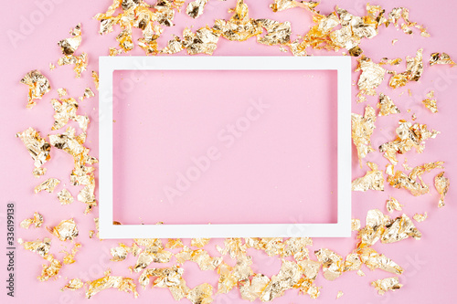 Frame with golden shimmer glitter over the pink pastel background