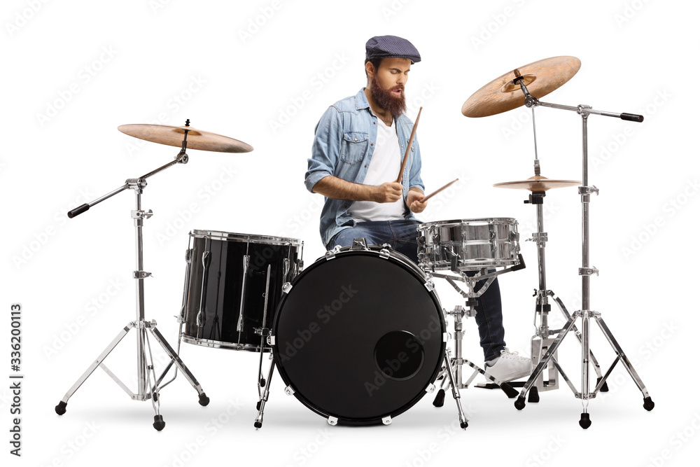 Fototapeta premium Casual bearded guy mucician playing a drum set