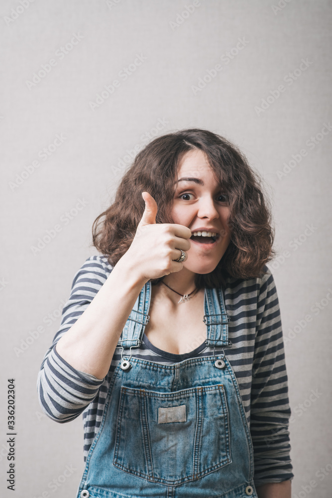 Smiling business woman thumb up show. Smiling business woman thumb up show.