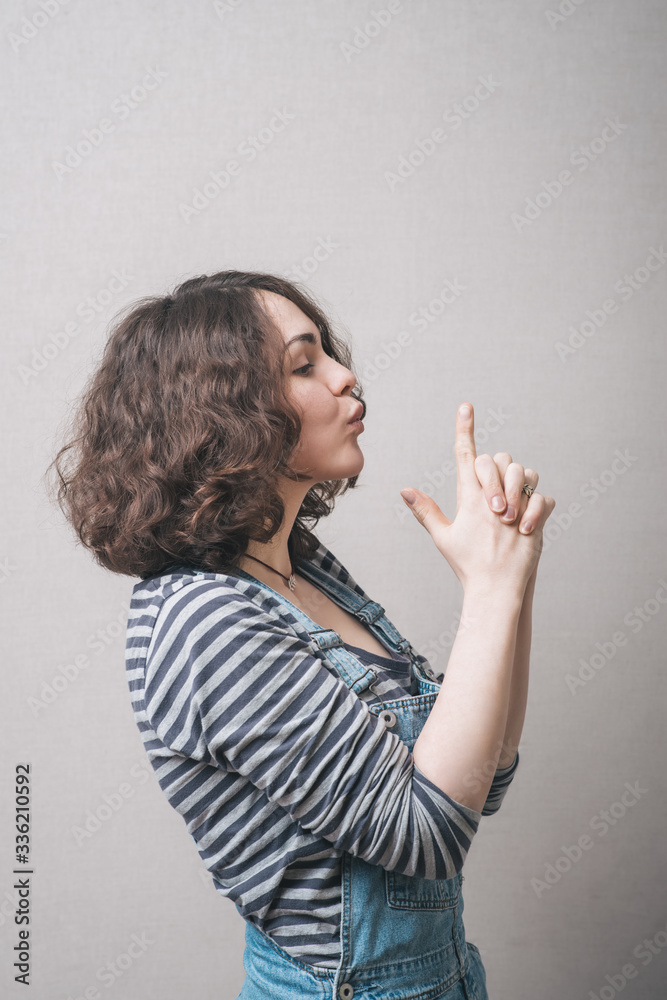 Fototapeta premium Beautiful Young Girl Hand Pretending To Pistol Shoot