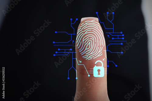 Businesswoman using fingerprint protection for data access, closeup