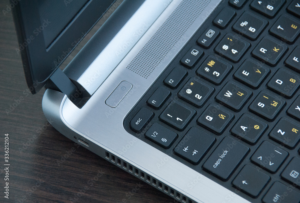 Laptop switch button. On-off button. Laptop keyboard closeup. Top view Laptop switch button. On-off button. Laptop keyboard closeup. Top view