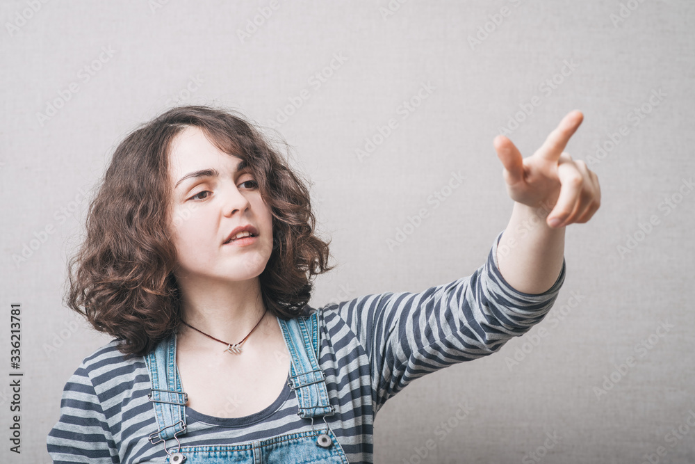 woman mocks someone dressed in overalls woman mocks someone dressed in overalls