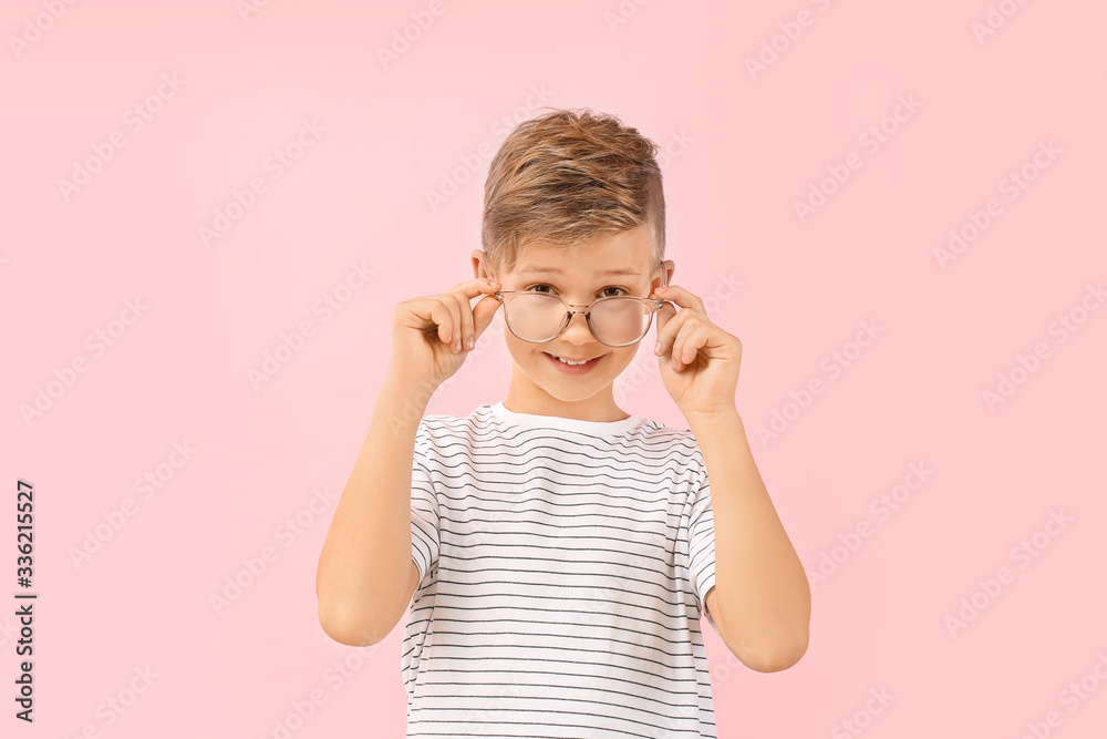 Cute little boy with eyeglasses on color background Cute little boy with eyeglasses on color background