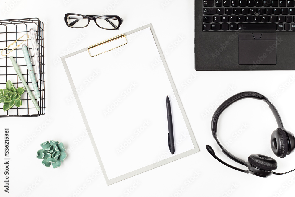 Top view of office desk. Table with laptop and office supplies. Flat lay home office workspace, remote work, distant learning, video conference, calls idea