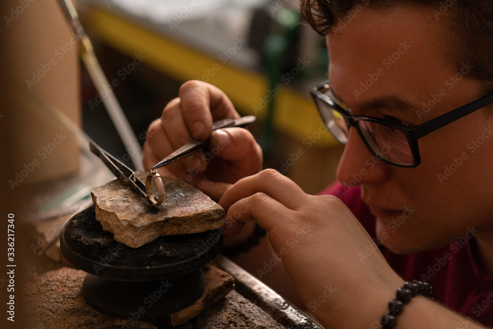 Jeweler putting gem on ring Stock Photo Adobe Stock