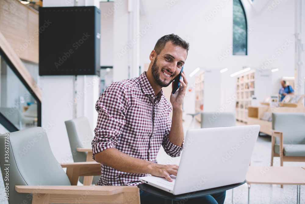 Young white toothed man speaking on smartphone Young white toothed man speaking on smartphone