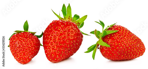 Strawberries with leaves isolated on a white background.