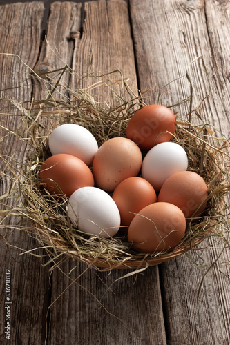 Hen eggs on a rustic background