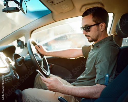 Man using navigation system when he driving car photo