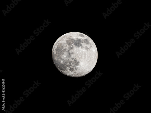 Full moon on black sky background © Sergey